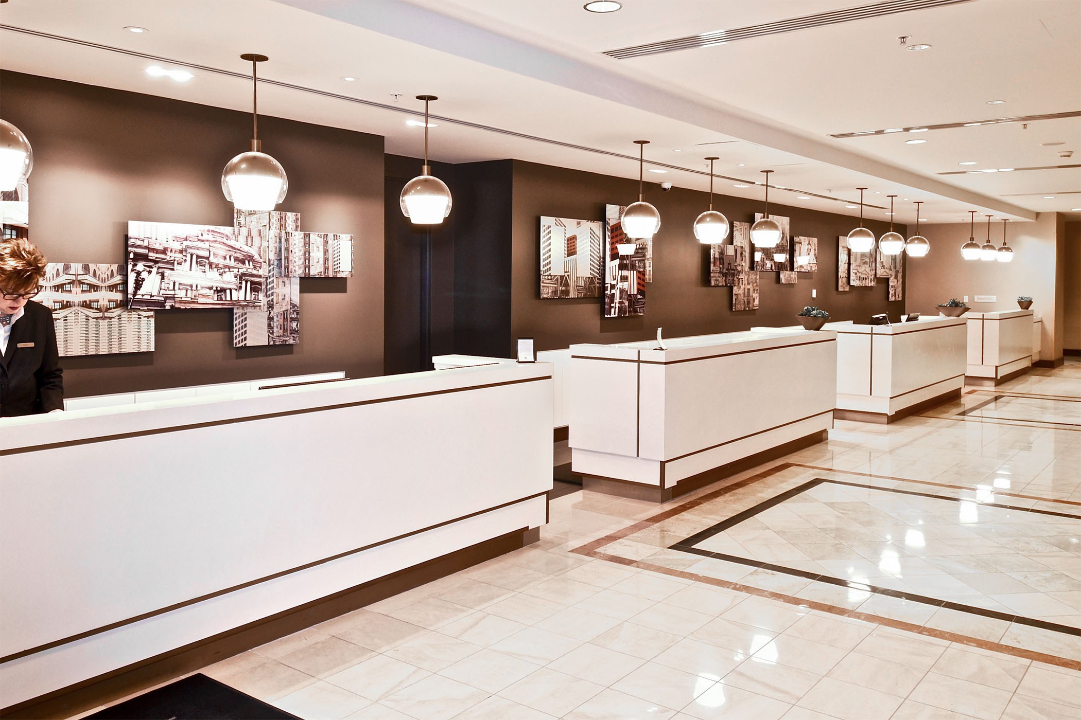 St. Louis Marriott Grand lobby, installed panels with hotel staff at desk